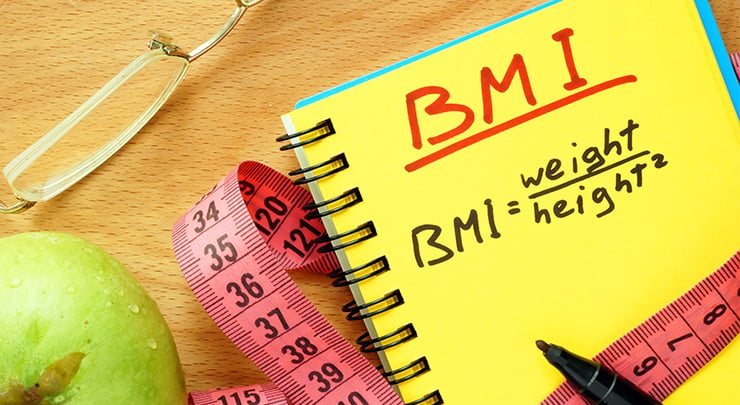 BMI formula to calculate weight is written out for tummy tuck patient.